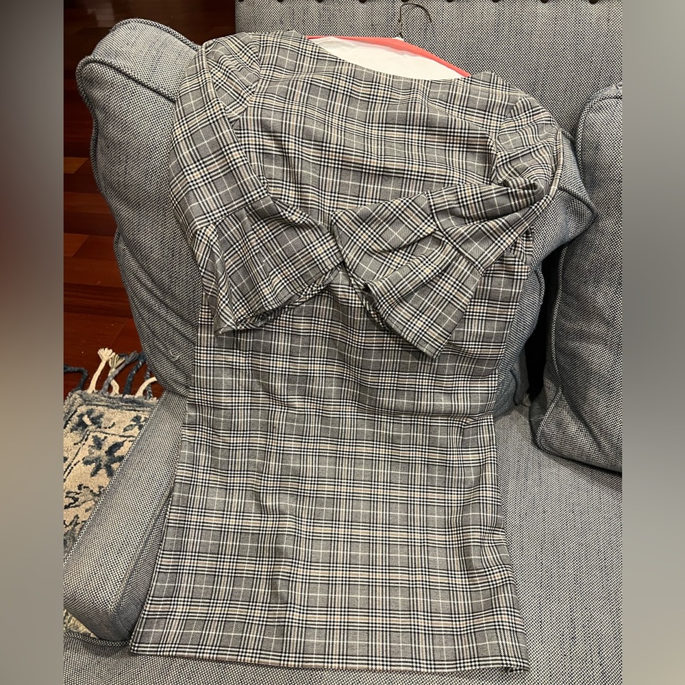 Fitting plaid grey dress, perfect for office or formal wear.